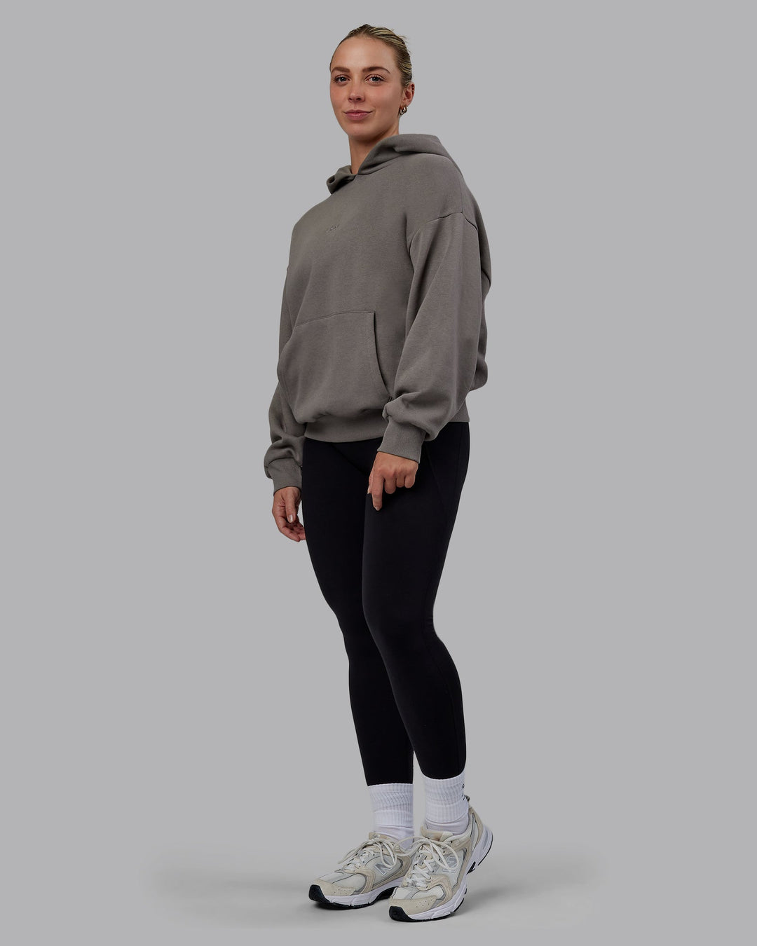 Woman wearing Unisex MVP Hoodie Oversize - Storm Front