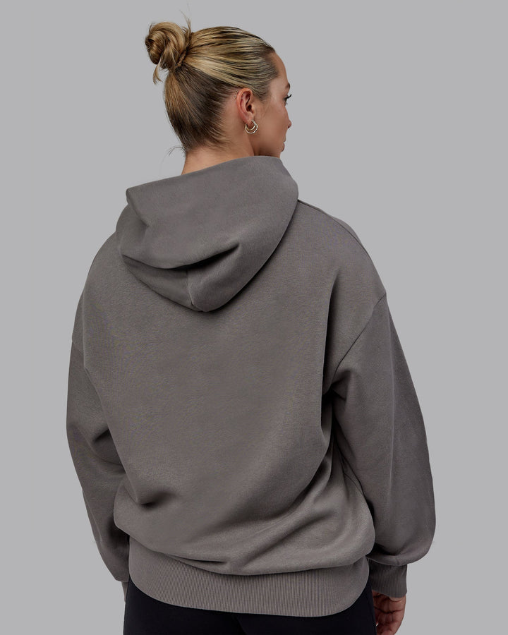 Woman wearing Unisex MVP Hoodie Oversize - Storm Front
