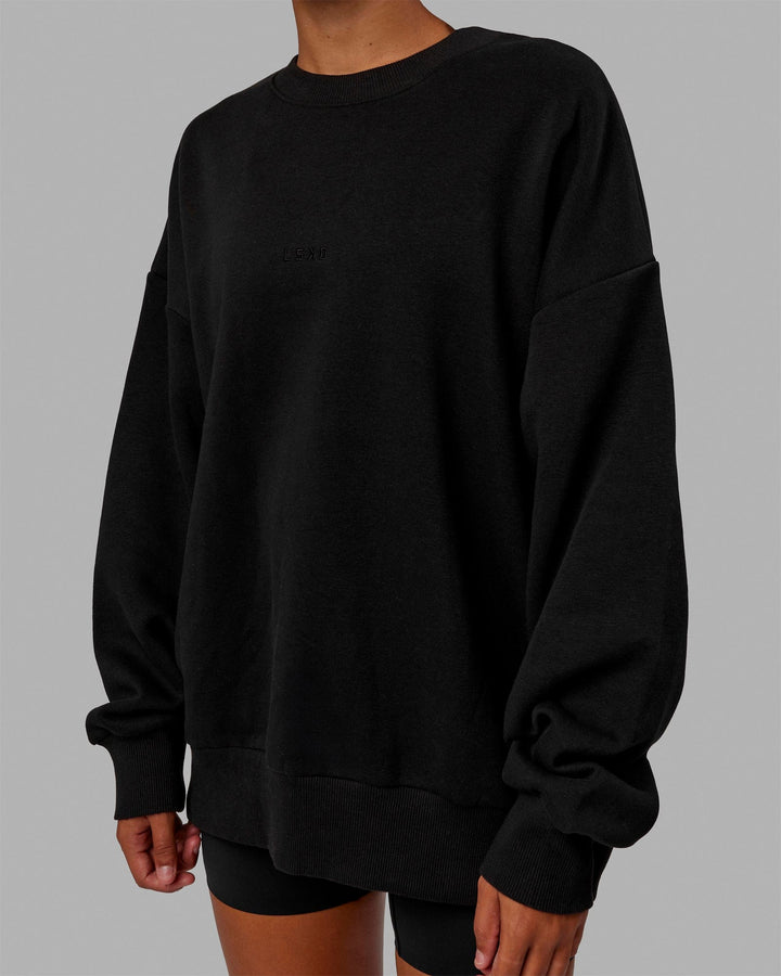 Woman wearing Unisex MVP Sweater Oversize - Black