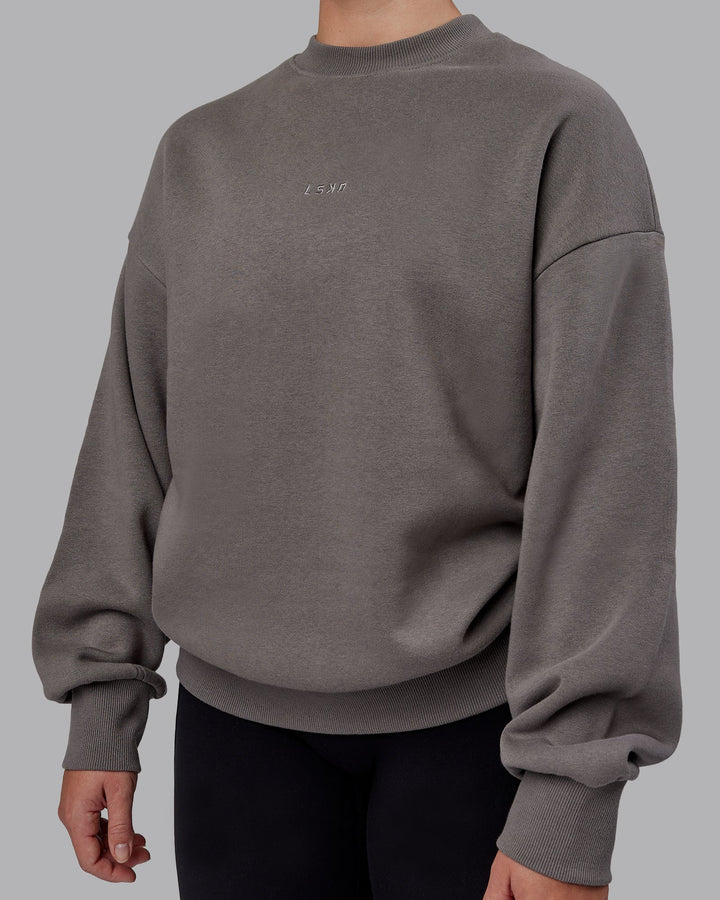 Woman wearing Unisex MVP Sweater Oversize - Storm Front
