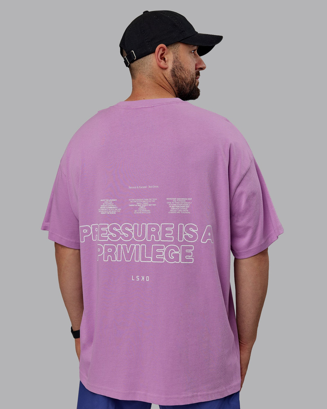 Man wearing Unisex Pressure Heavyweight Tee Oversize - Light Violet-White