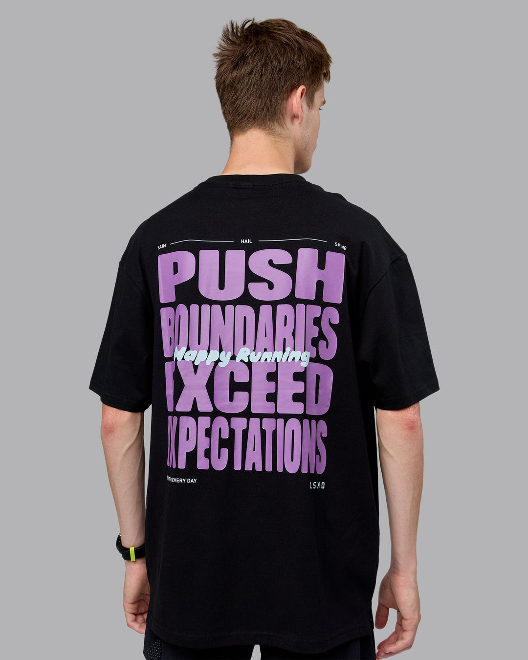 Man wearing Unisex Push Boundaries FLXCotton Tee Oversize - Black-Purple Swirl