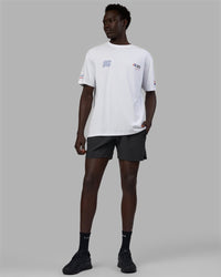 Man wearing Unisex Redline FLXCotton Tee Oversize - White-Navy