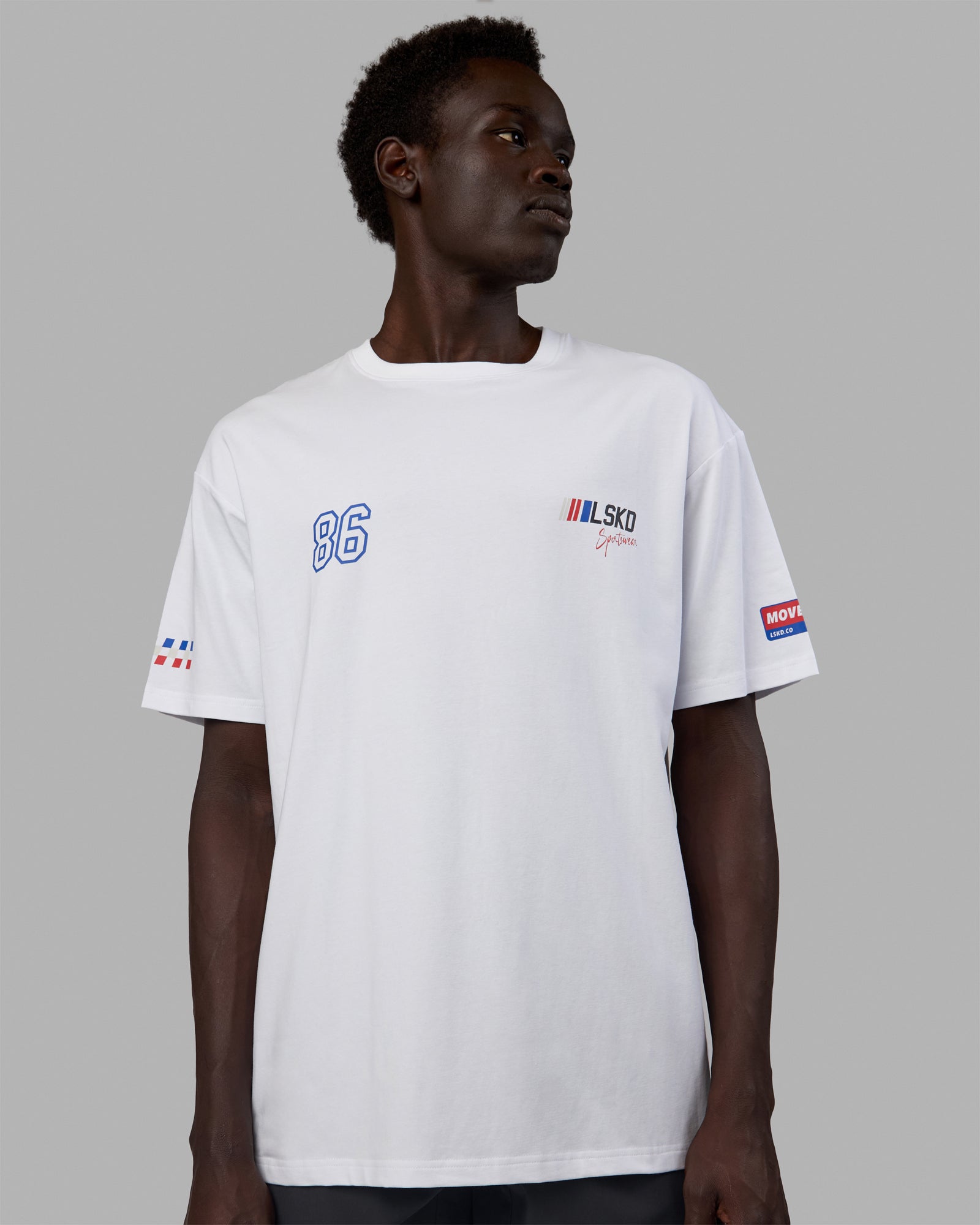 Man wearing Unisex Redline FLXCotton Tee Oversize - White-Navy
