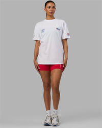 Woman wearing Unisex Redline FLXCotton Tee Oversize - White-Navy
