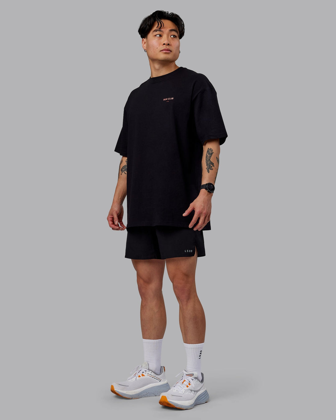 Man wearing Unisex RUN CLUB FLXCotton Tee Oversize - Black-Cayenne