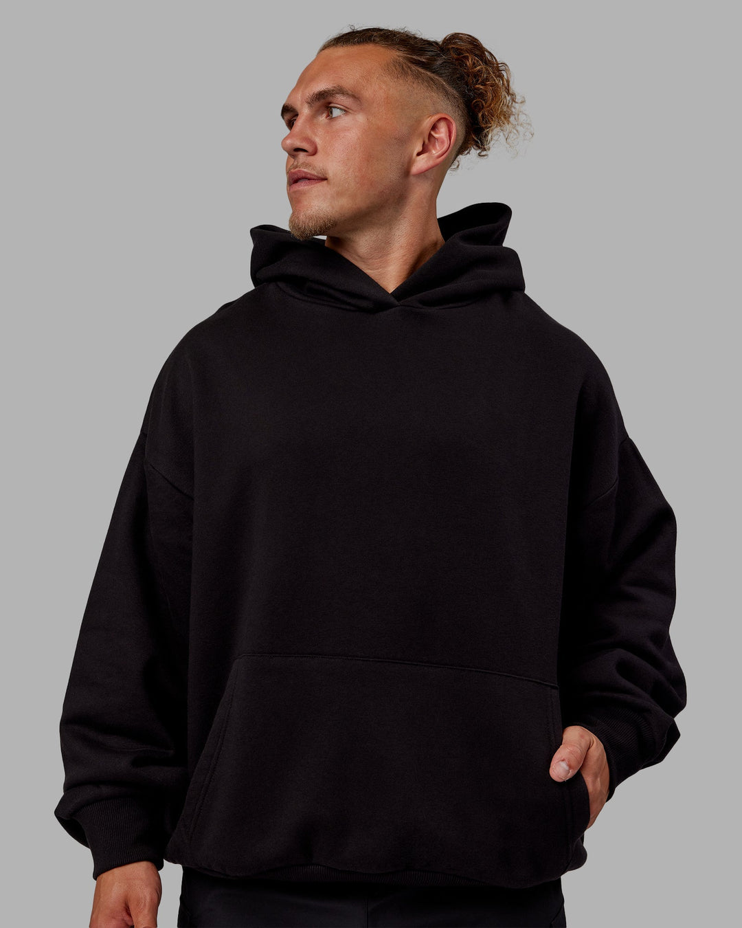 Man wearing Sara Unisex Hoodie Oversize - Black-Black