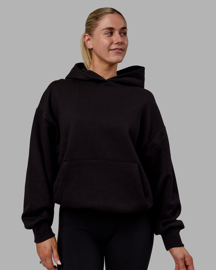 Woman wearing Sara Unisex Hoodie Oversize - Black-Black
