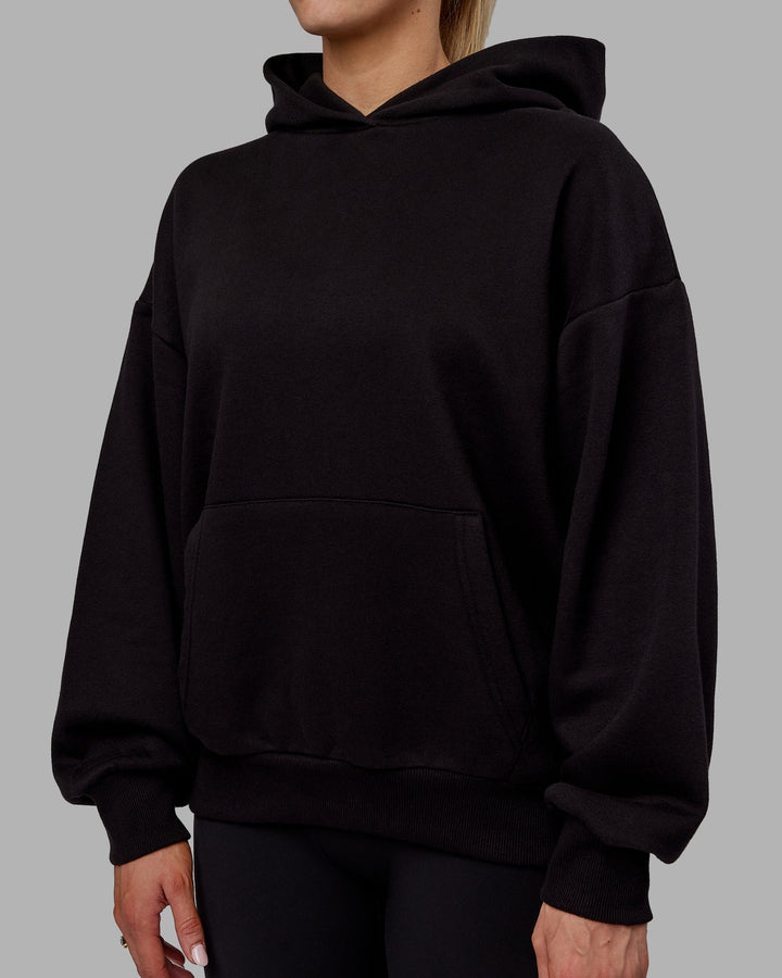 Woman wearing Sara Unisex Hoodie Oversize - Black-Black
