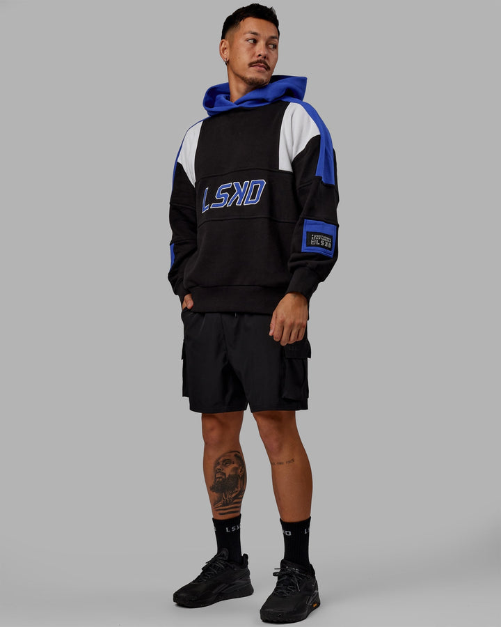 Man wearing Unisex Slam Hoodie Oversize - Black-Power Cobalt
