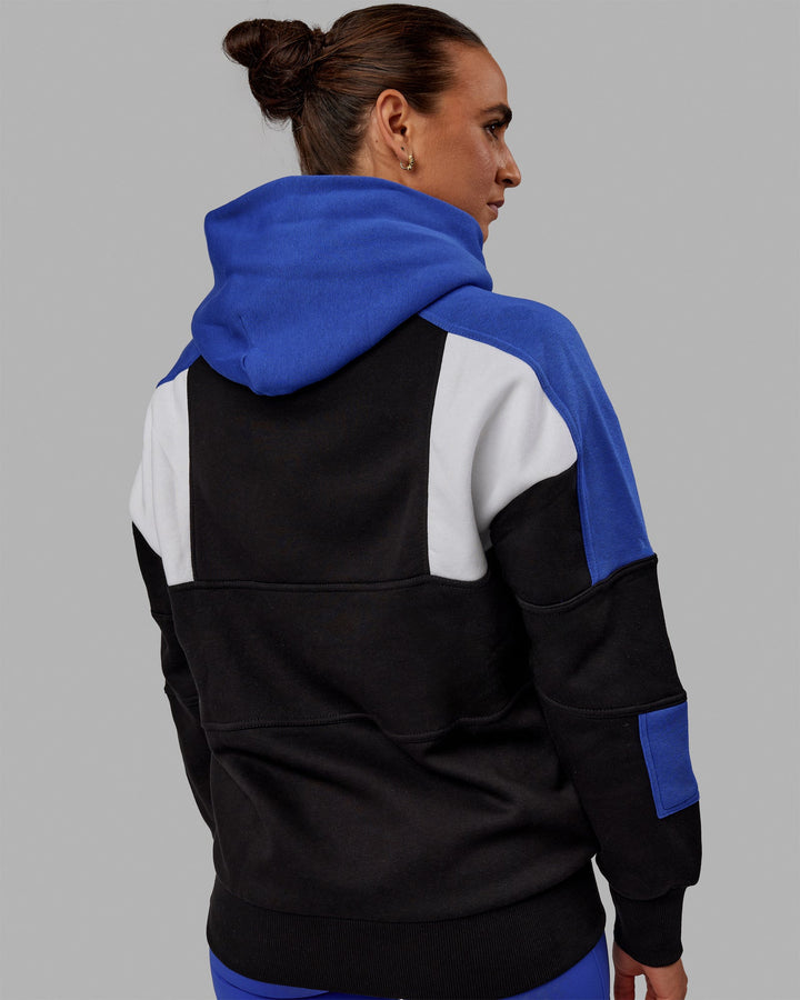 Woman wearing Unisex Slam Hoodie Oversize - Black-Power Cobalt
