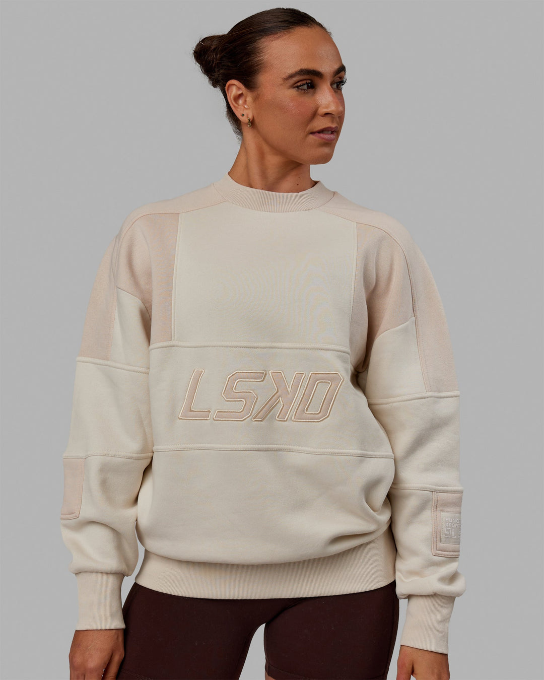 Woman wearing Unisex Slam Sweater Oversize - Bone-Pumice Stone