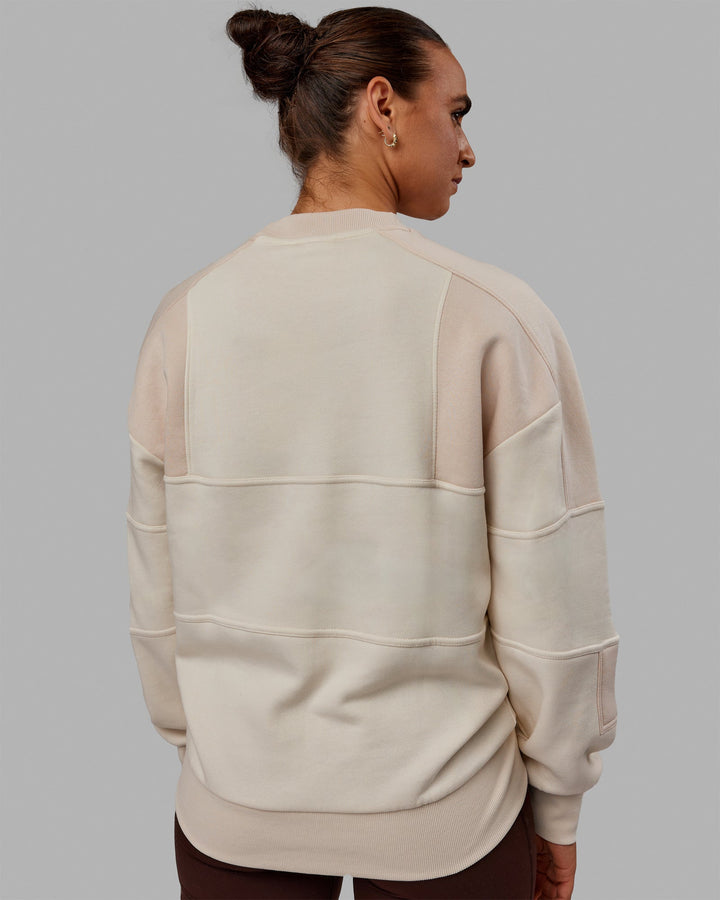 Woman wearing Unisex Slam Sweater Oversize - Bone-Pumice Stone