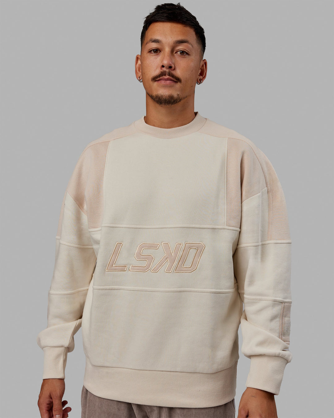 Man wearing Unisex Slam Sweater Oversize - Bone-Pumice Stone