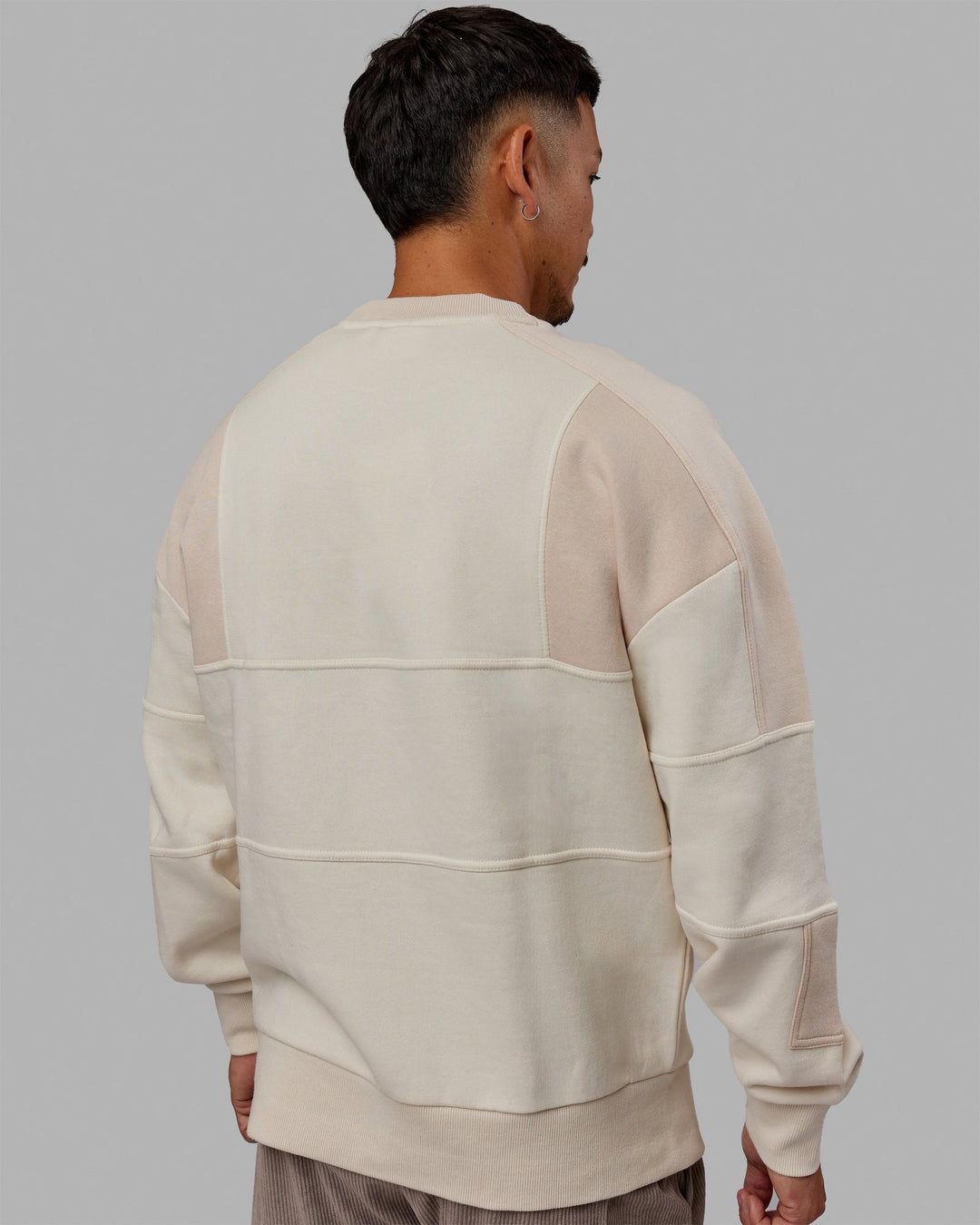 Man wearing Unisex Slam Sweater Oversize - Bone-Pumice Stone