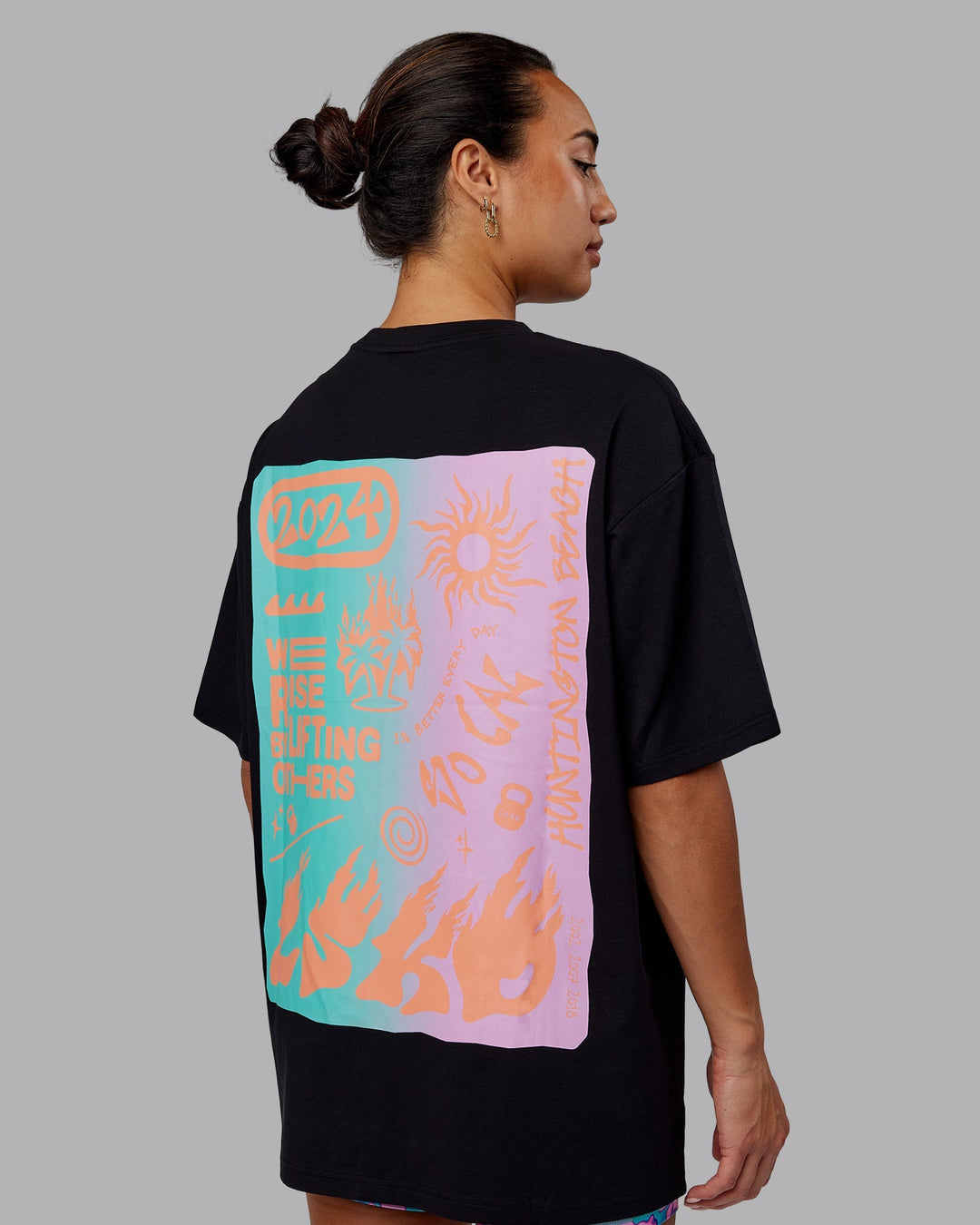 Woman wearing Unisex So Cal 24 FLXCotton Tee Oversize - Black-Beacon Orange