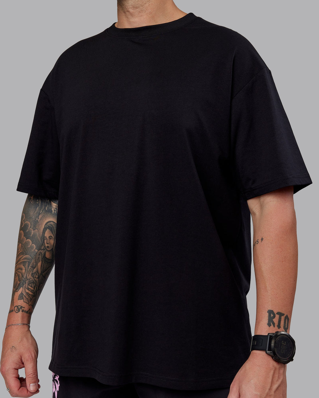 Man wearing Unisex So Cal 24 FLXCotton Tee Oversize - Black-Beacon Orange