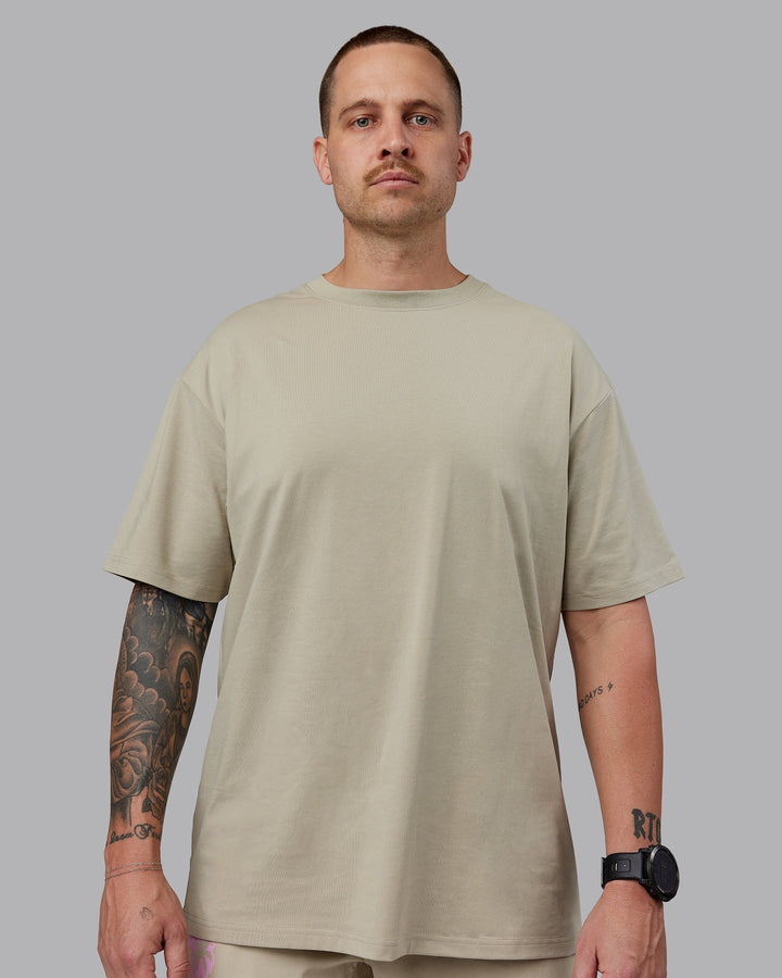 Man wearing Unisex So Cal 24 FLXCotton Tee Oversize - Sustained Grey-Atlantis
