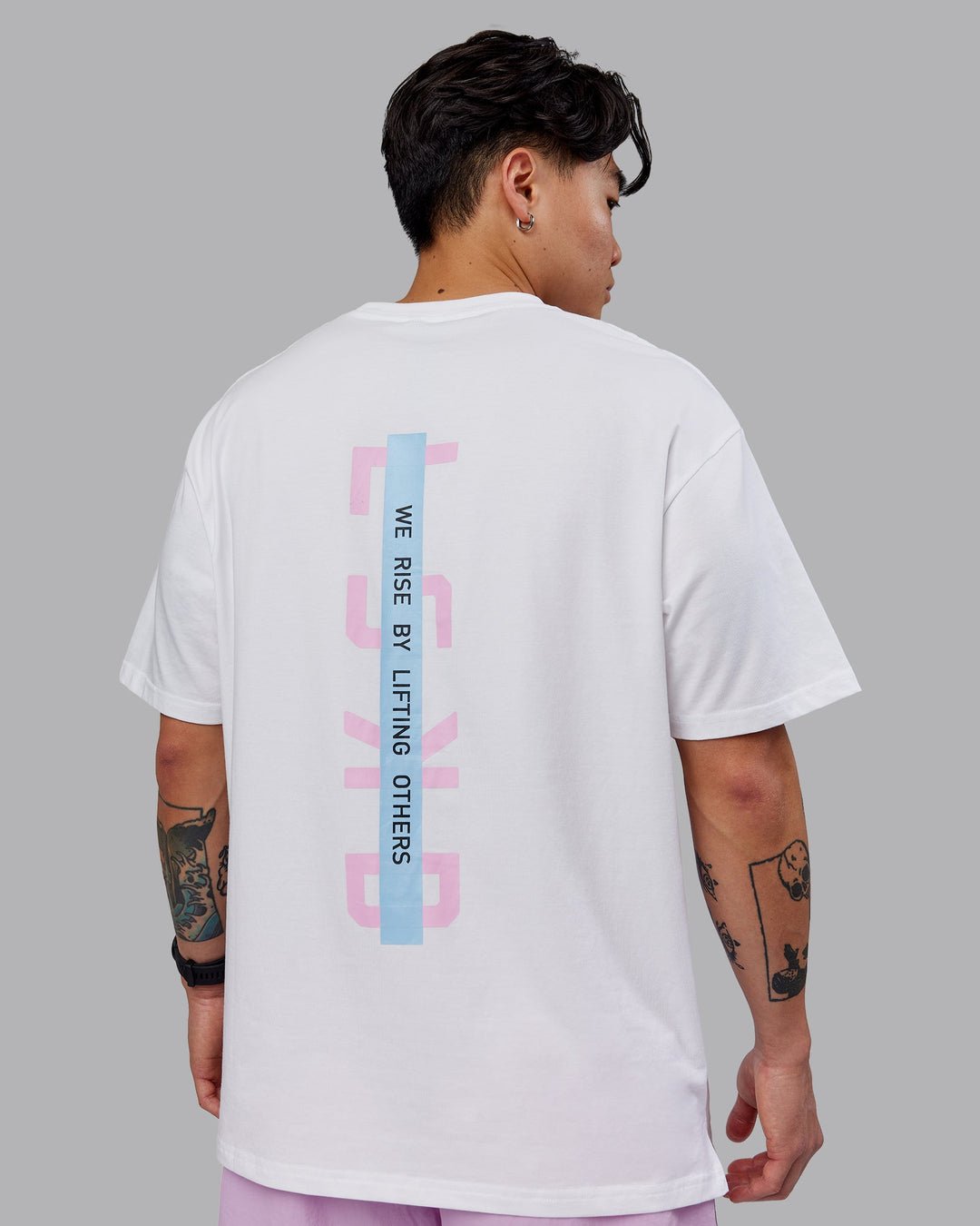 Man wearing Unisex Strike Through FLXCotton Tee Oversize - White-Bubblegum