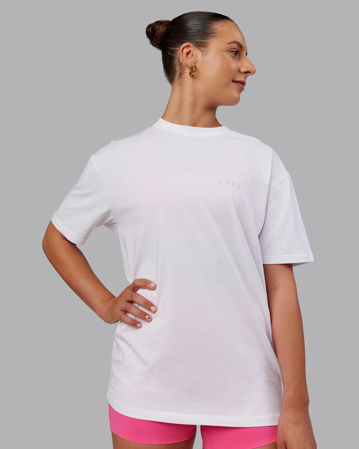 Woman wearing Unisex Strike Through FLXCotton Tee Oversize - White-Bubblegum
