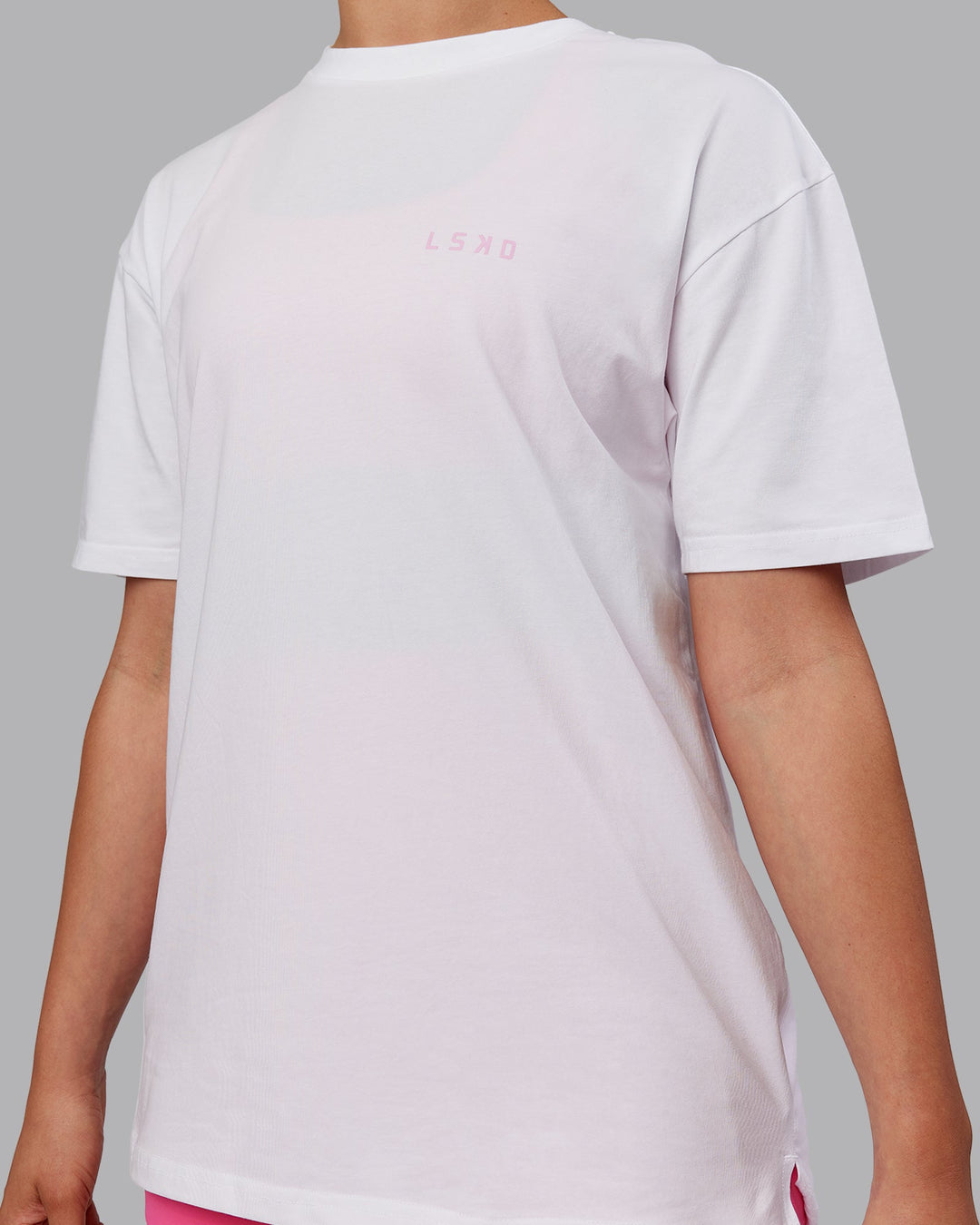 Woman wearing Unisex Strike Through FLXCotton Tee Oversize - White-Bubblegum