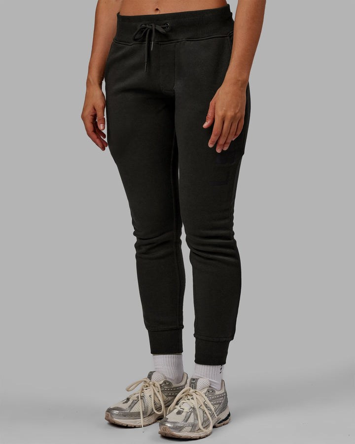 Woman wearing Unisex Structure Joggers - Pirate Black-Black