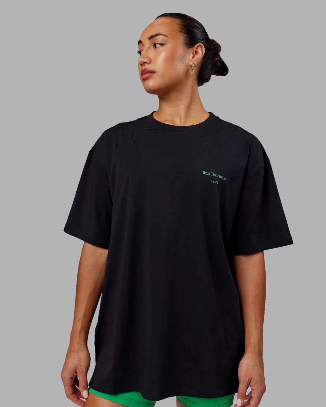 Woman wearing Unisex Trust The Process 2.0 FLXCotton Tee Oversize - Black-Impact Green