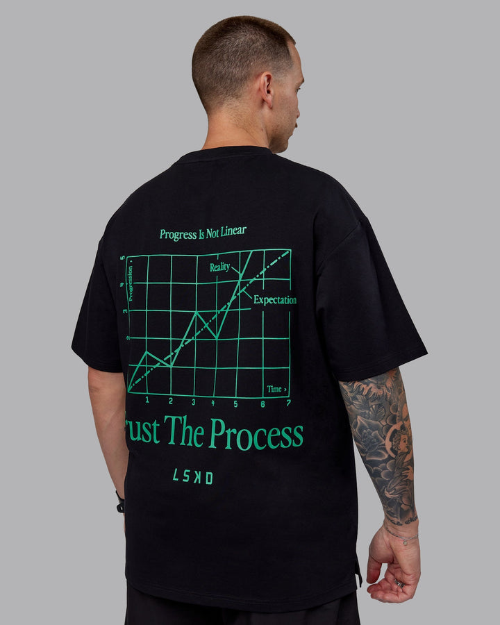 Man wearing Unisex Trust The Process 2.0 FLXCotton Tee Oversize - Black-Impact Green
