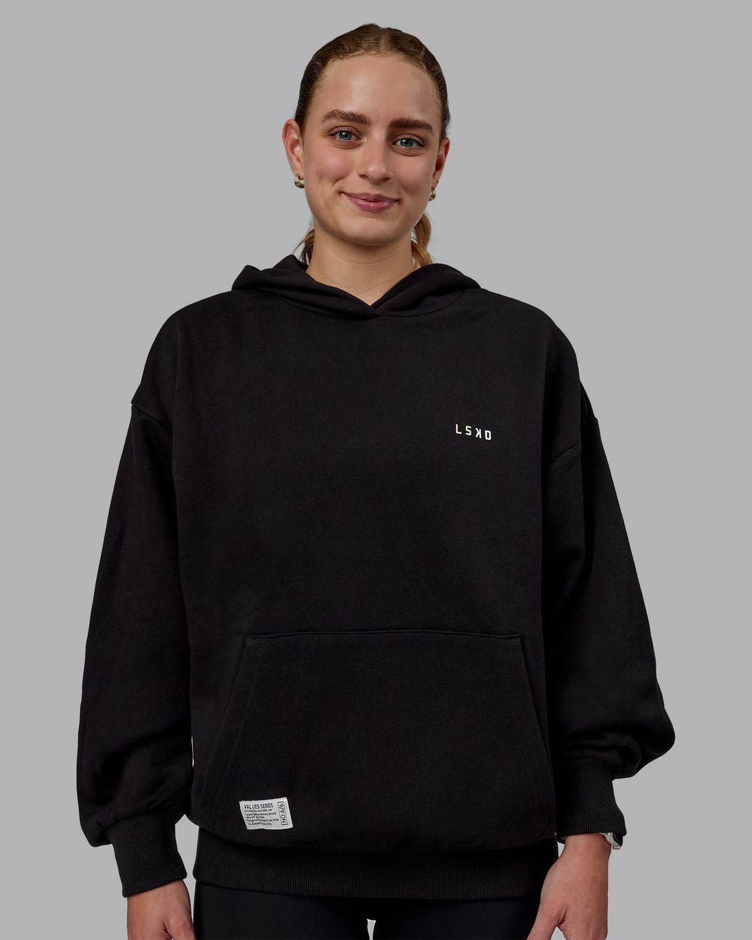 Woman wearing Unisex VS6 Hoodie Oversize - Pride-Black