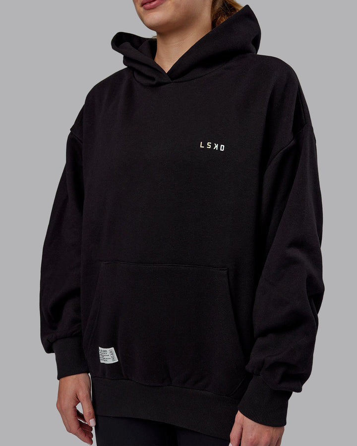 Woman wearing Unisex VS6 Hoodie Oversize - Pride-Black
