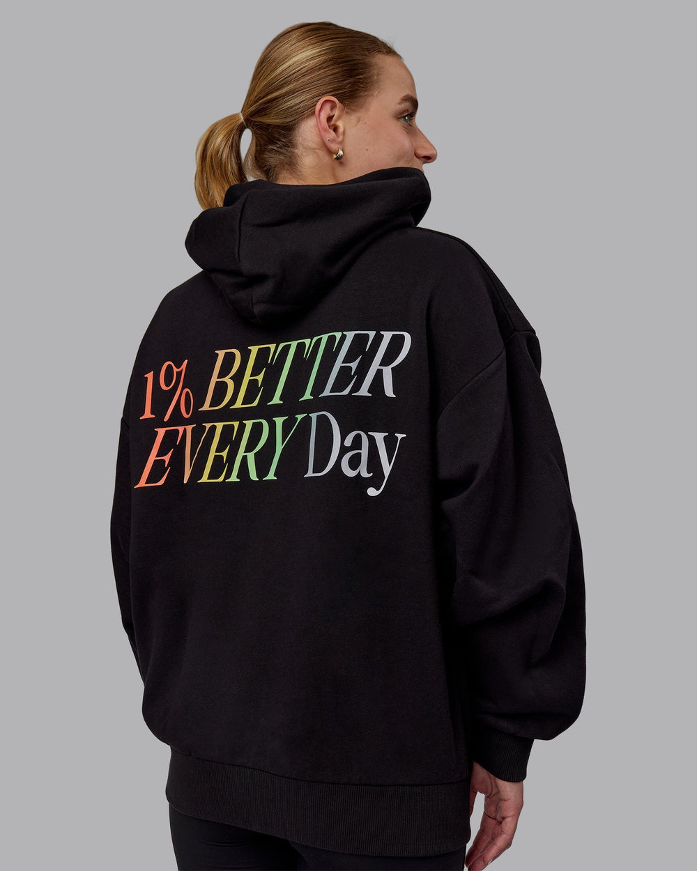 Woman wearing Unisex VS6 Hoodie Oversize - Pride-Black