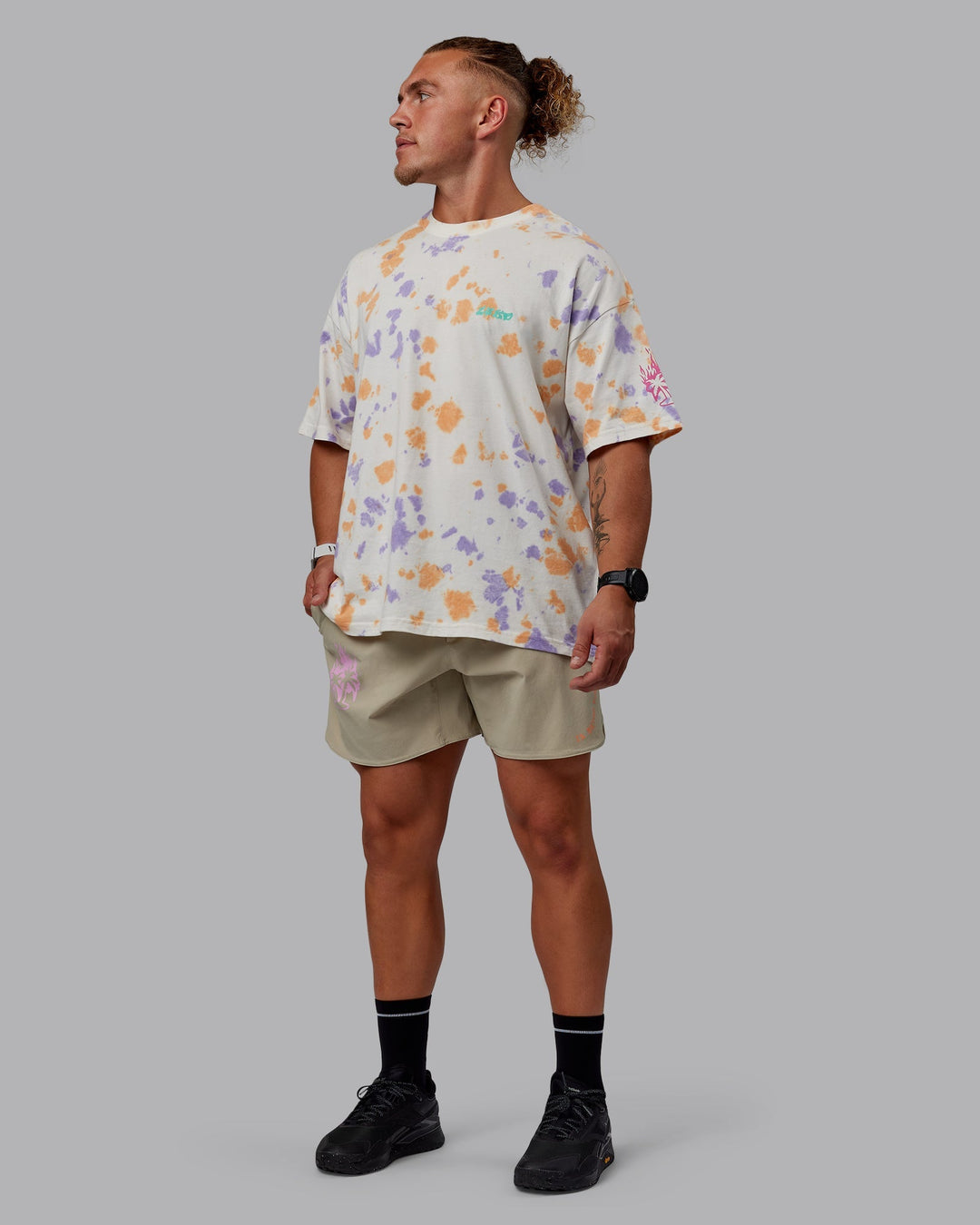 Man wearing Unisex Washed Huntington 24 Heavyweight Tee Oversize - Tie Dye Tangerine-Dahlia Purple