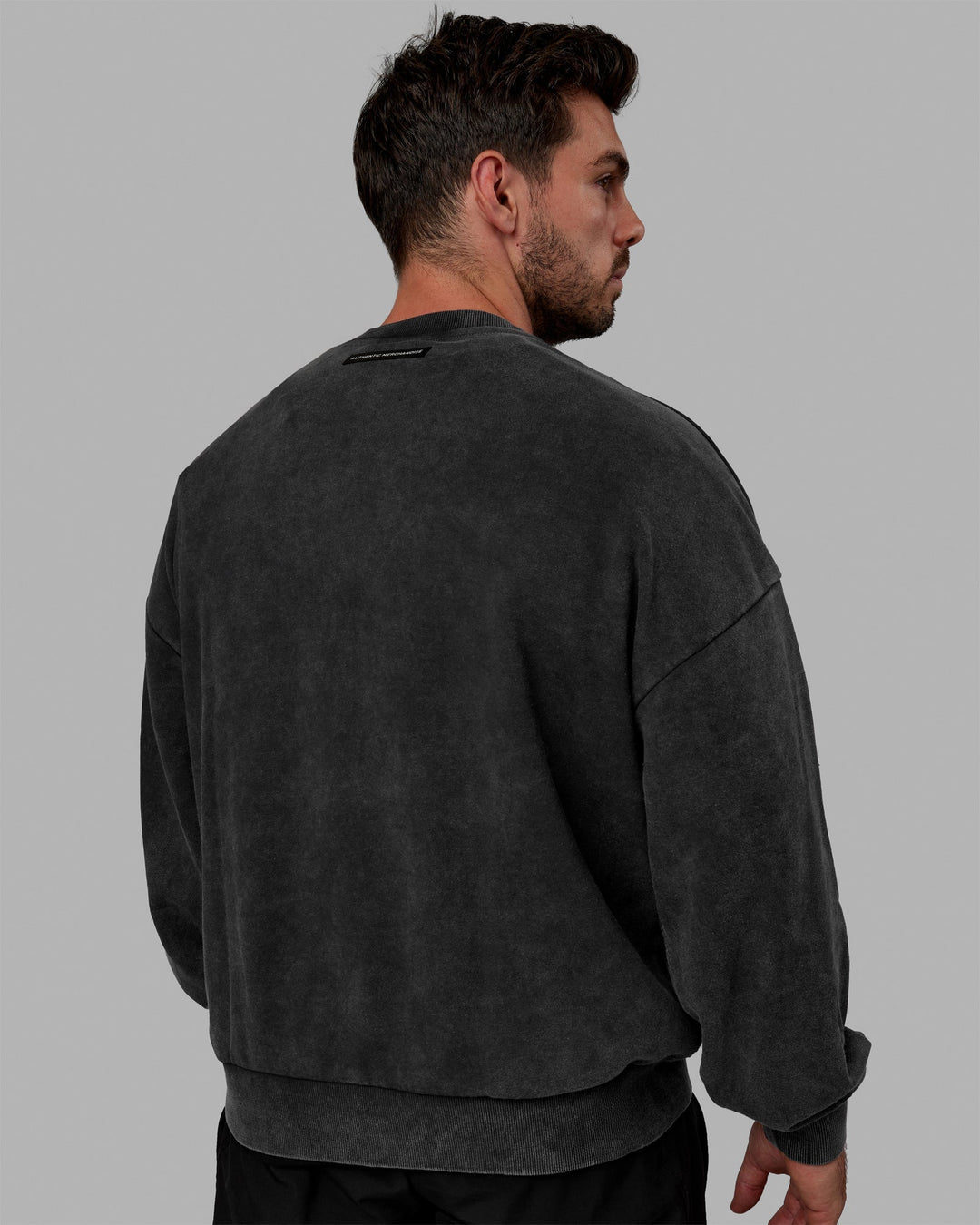 Man wearing Unisex Washed Segmented Sweater Oversize - Black