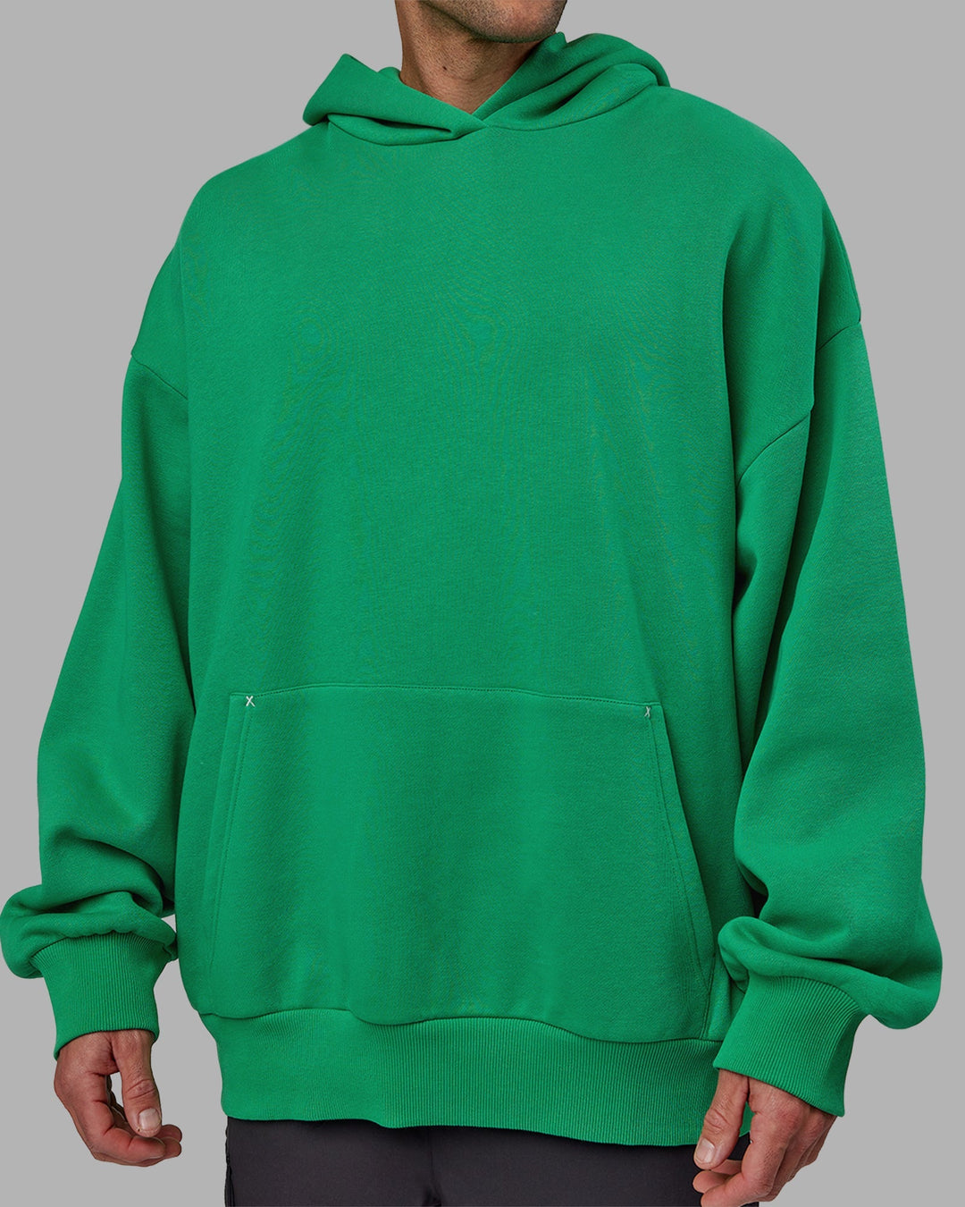 Man wearing Unisex We Rise Hoodie Oversize - Impact Green-White