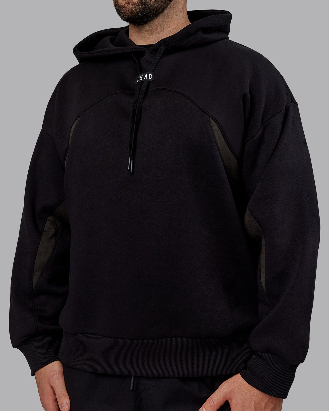 Man wearing Unisex Y2K Concept Panel Hoodie - Black-Black-Pirate Black