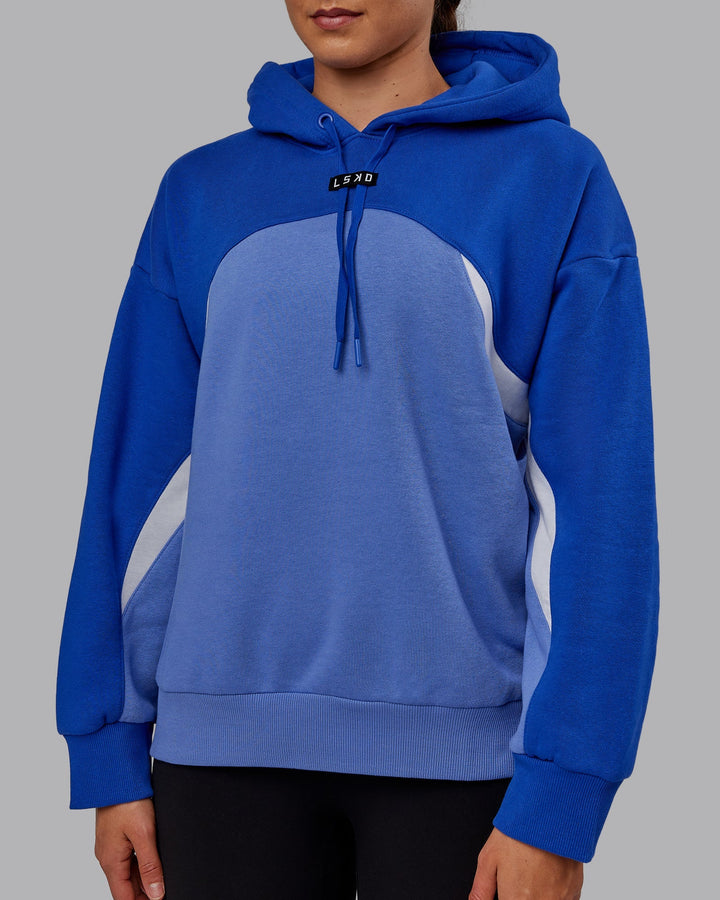 Woman wearing Unisex Y2K Concept Panel Hoodie - Power Cobalt-White
