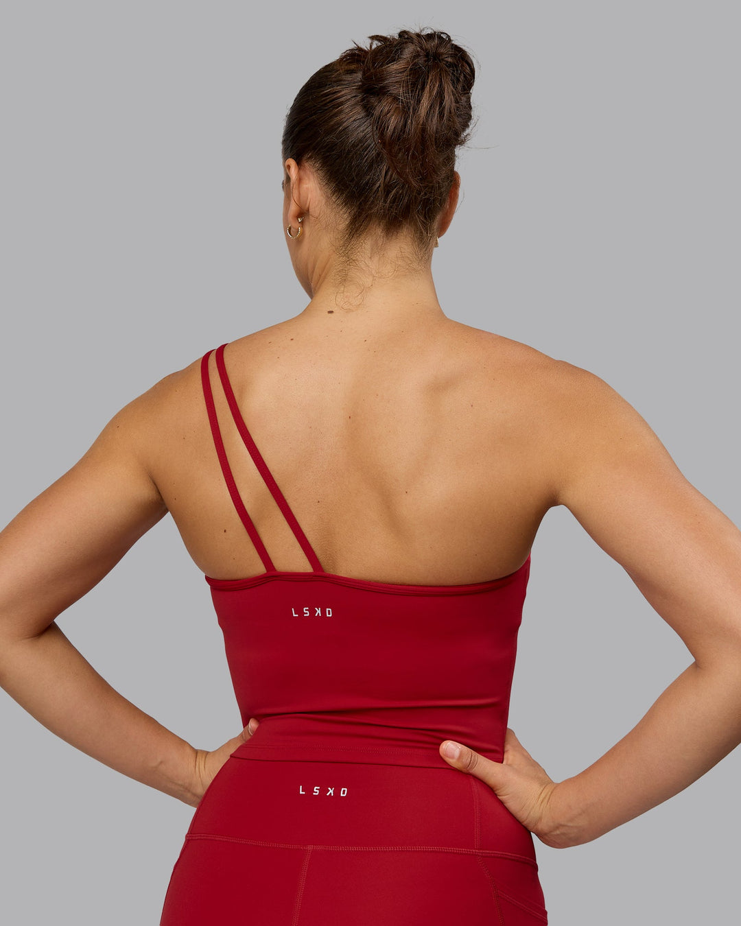 Woman wearing Vivid Skimmer Shelf Bra Tank - Cherry Red