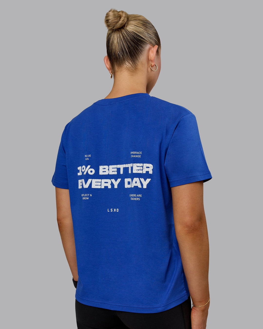 Woman wearing 1% Better Value Series FLXCotton Tee - Power Cobalt-White