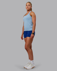 Woman wearing AeroFLX+ Seamless Tank - Elemental Blue/Ice Blue