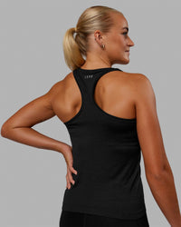 Woman wearing AeroFLX+ Seamless Tank - Black Marl
