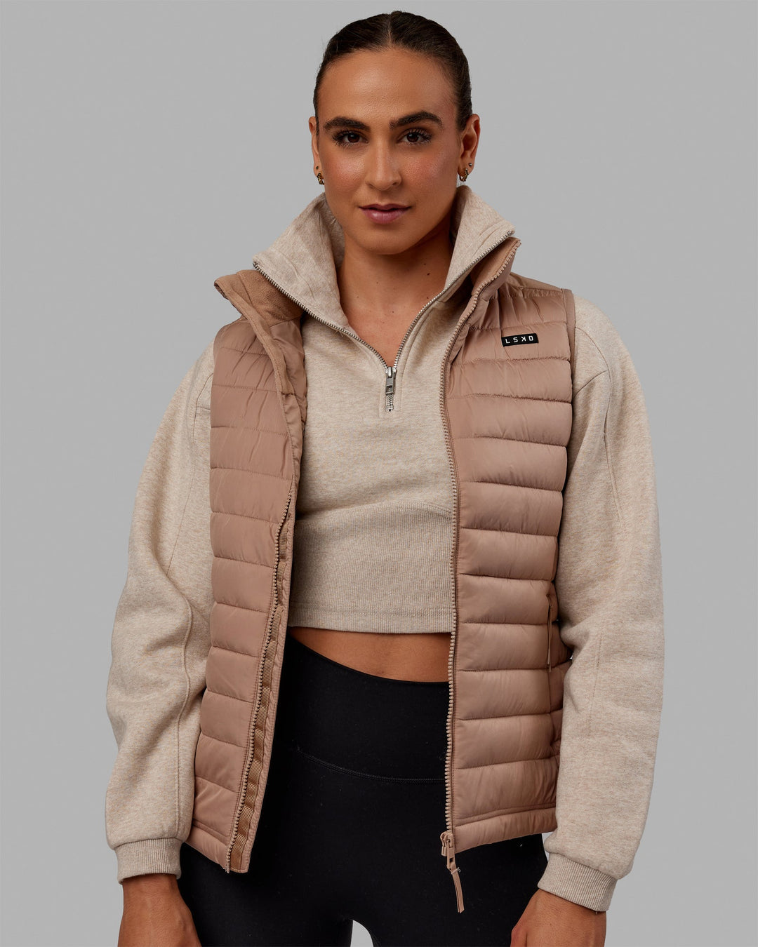 Woman wearing All Day Puffer Vest - Desert