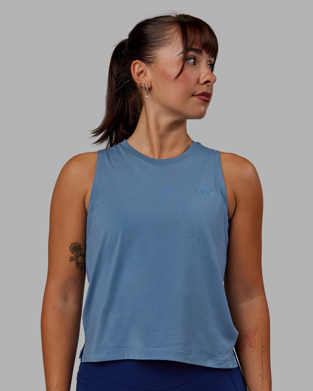 Woman wearing Deluxe PimaFLX Tank - Elemental Blue