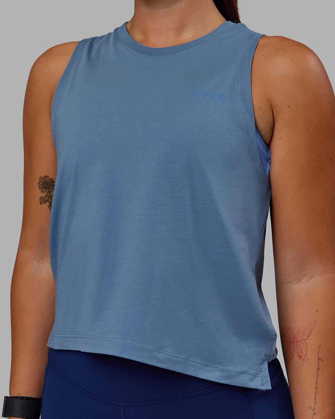 Woman wearing Deluxe PimaFLX Tank - Elemental Blue