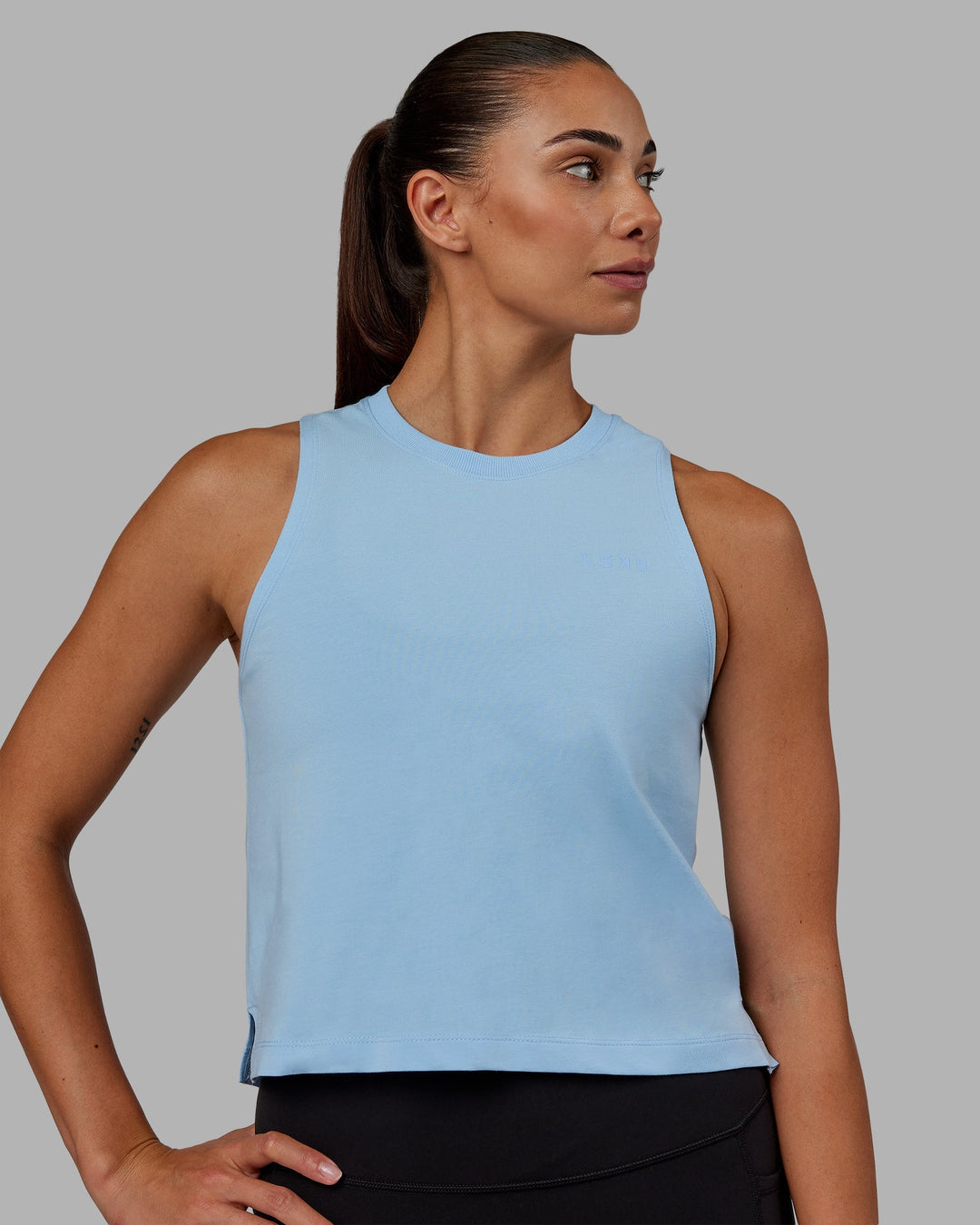 Woman wearing Deluxe PimaFLX Tank - Glacial Blue