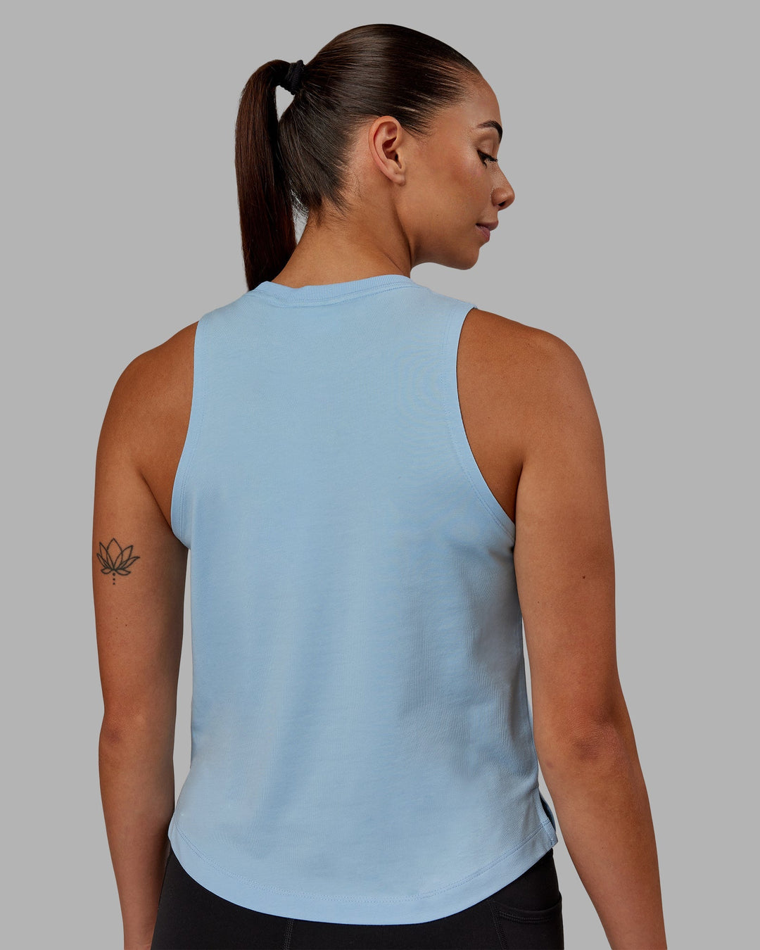 Woman wearing Deluxe PimaFLX Tank - Glacial Blue