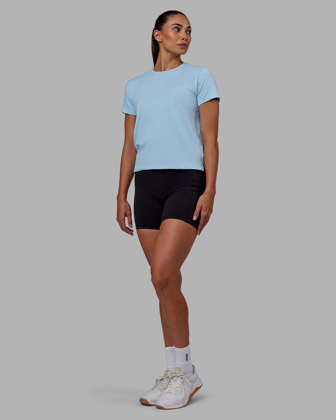 Woman wearing Deluxe PimaFLX Tee - Glacial Blue