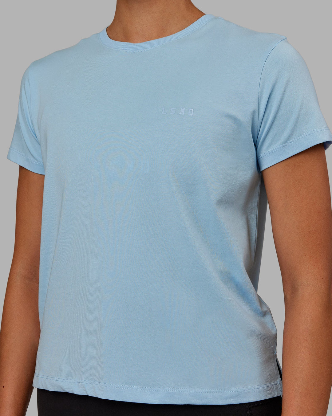 Woman wearing Deluxe PimaFLX Tee - Glacial Blue