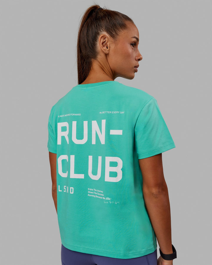 Woman wearing Love The Run FLXCotton Tee - Aquatic Awe-White