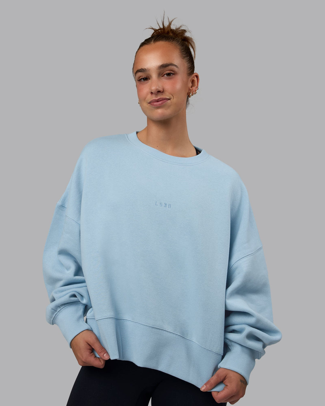 Woman wearing MVP Oversized Sweater - Glacial Blue