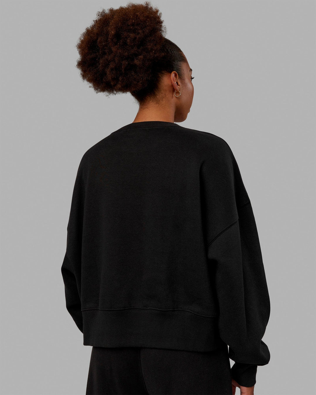 Woman wearing MVP Oversized Sweater - Black